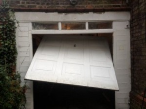 An old broken garage door and the replacement of a Woodrite Buckingham                     